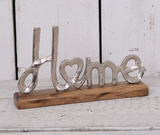 Metal Home Ornament on Wooden Stand